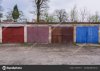 depositphotos_208570074-stock-photo-row-old-garages-metal-gates.jpg